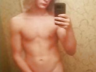 Long hair young guy jerks dick in mirror