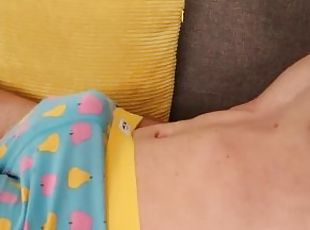 Masturbating in colorful boxers on a sofa
