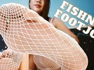 Practicing Footjob in Fishnets on a Dildo
