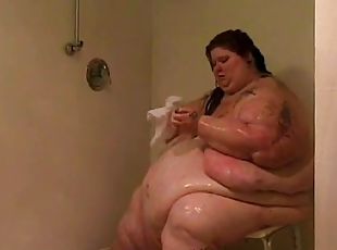 Huge fat chick undresses and takes a shower