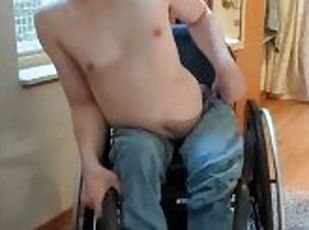 Paraplegic strips in his wheelchair