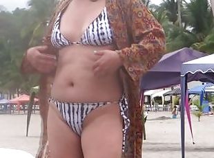 On the beach, stepmom shows off and loves making cocks hard